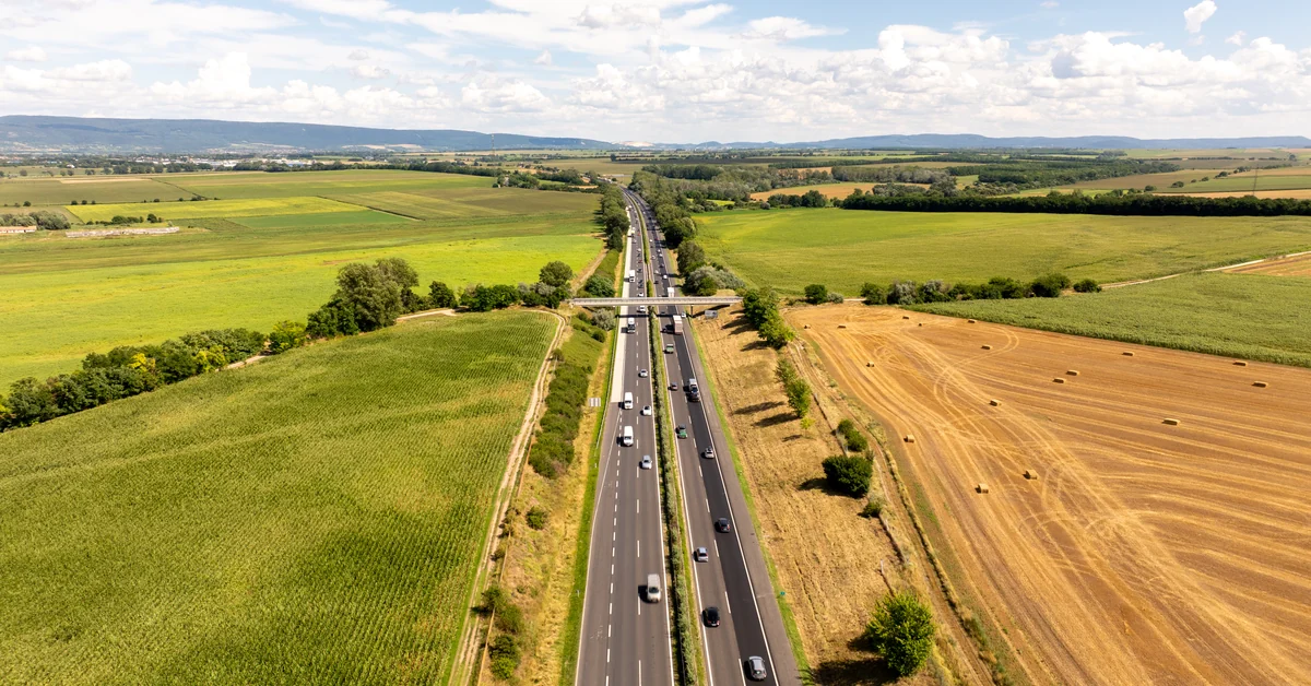 Aerial view of a motorway in Hungary with cars and trucks — the e-vignette is mandatory